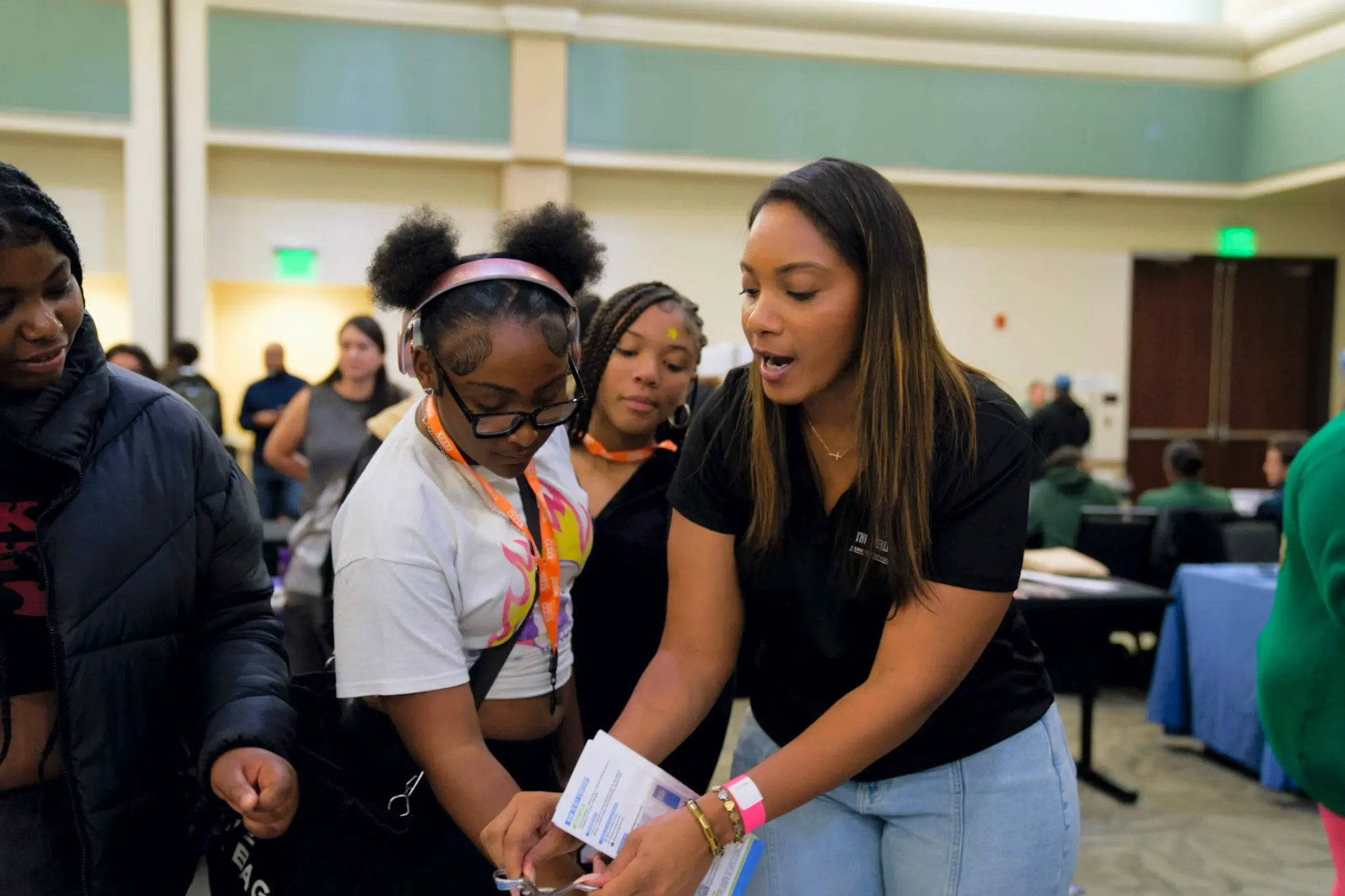 A sterile processing educator guiding students through an instrument learning activity
